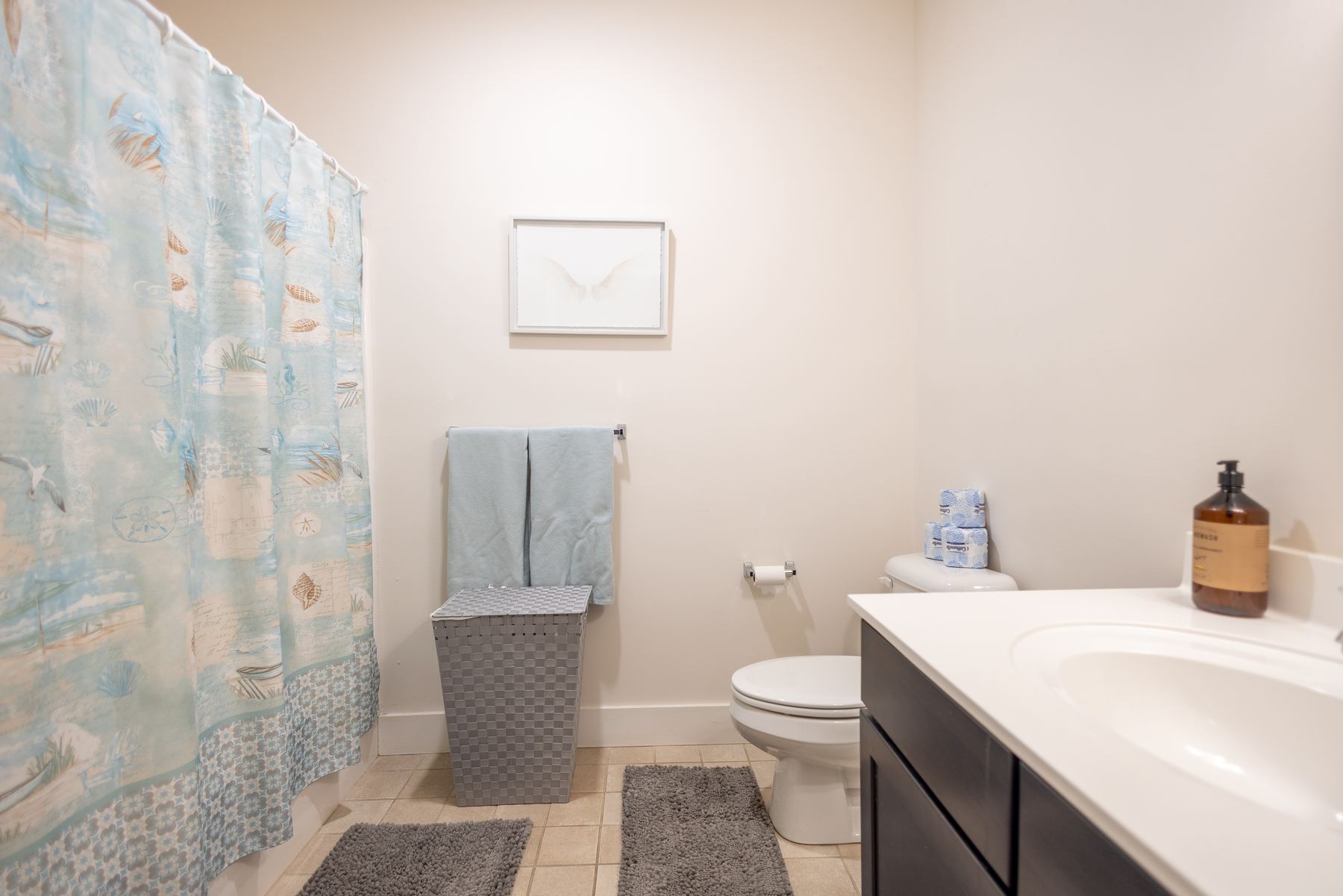 Bathroom with soaking tub and tile flooring